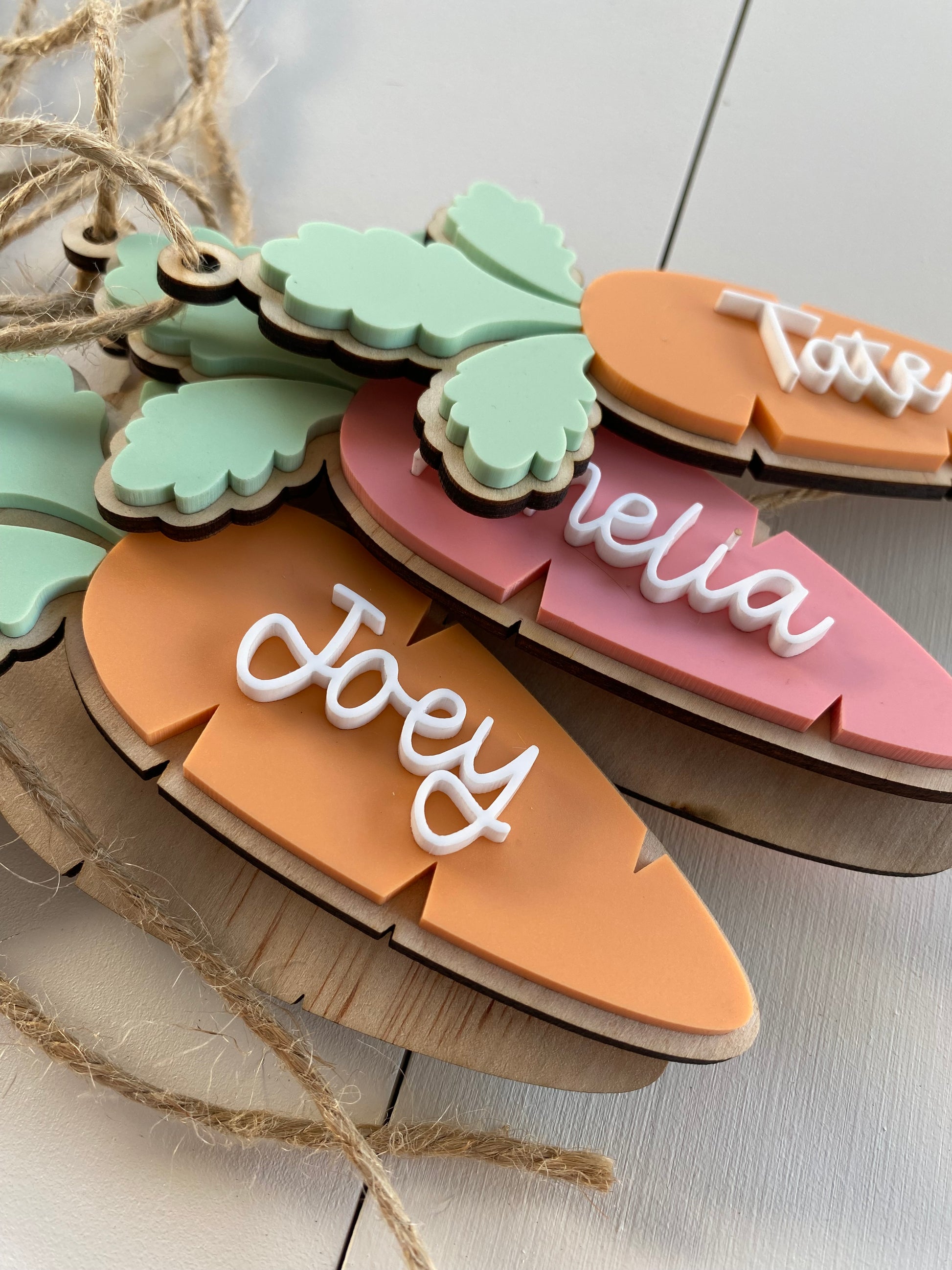 Colorful name tags on a wooden board with a neutral background